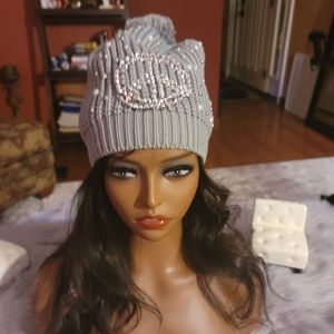 Hat with silver peace sign embellishment